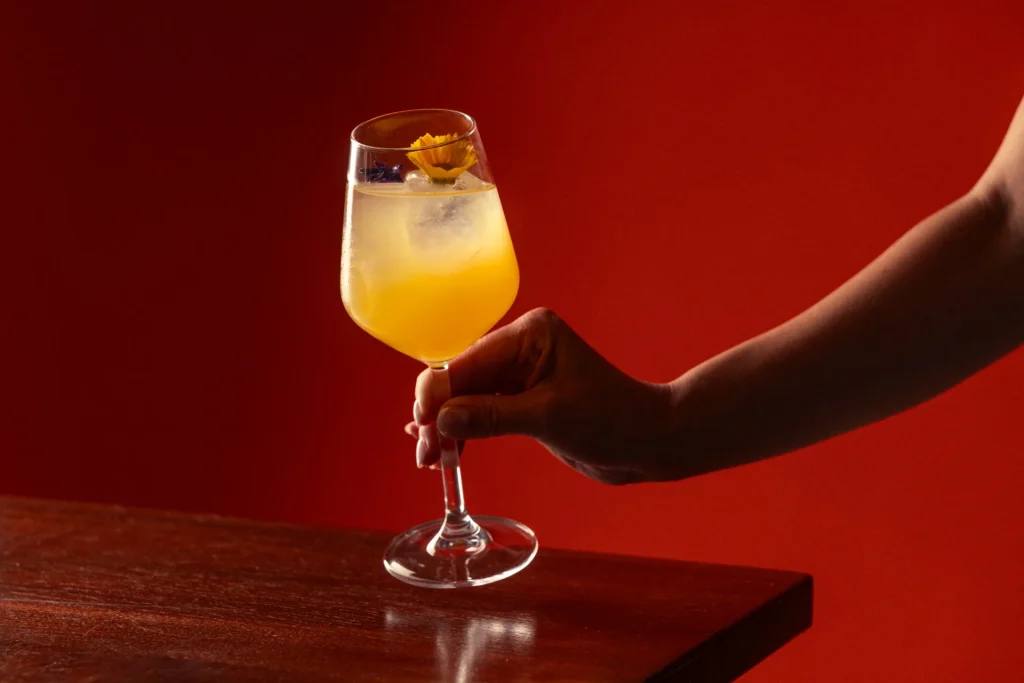 Desiderio passion fruit cocktail with an edible flower at Matto in St George’s Bay